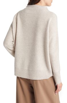 The softest cashmere is also structured enough to form a seamless funnel neck atop this super-cozy sweater styled with dropped shoulders and wide ribbed bands. 25" length (size Medium) Exclusive retailer Funnel neck Long sleeves Ribbed cuffs and hem 100% cashmere Dry clean or hand wash, dry flat Imported Long Sleeve Cashmere Soft Knit Turtleneck, Casual Cashmere Sweater With Funnel Neck, Soft Knit Cashmere Turtleneck Sweater, Cashmere Funnel Neck Sweater For Layering, Cashmere Turtleneck For Fall, Cozy Cashmere Turtleneck Top, Cashmere Soft Knit Funnel Neck Turtleneck, Cozy Cashmere Turtleneck With Ribbed Collar, Oversized Cozy Cashmere Turtleneck