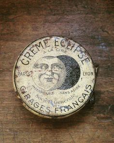 a close up of a wooden surface with a label on it that says cremee egliese cheese