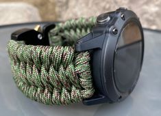 "FREE USPS PRIORITY MAIL SHIPPING FOR DOMESTIC US ORDERS (Includes U.S. Military APO/FPO Address Overseas) Thank you for visiting our shop \"Cording 2U\". A veteran owned business. Handcrafted Paracord wearables customized \"According To You\". Handcrafted with 100% Nylon Paracord \"MADE IN USA\" Our Products include: 🔹Custom handcrafted watch bands according to your wrist size, style, and color of choice. If you don't see it in our page yet, please contact us and we can discuss your options. ? Durable Green Digital Watch For Outdoor, Functional Green Watch Accessories For Outdoor, Functional Green Outdoor Watch Accessories, Durable Green Watch Bands For Outdoor, Paracord Watchband, Paracord Watch, Paracord Armband, Handmade Watch Bands, Garmin Fenix