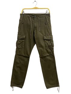 CODE : j/13/13 Vintage Blue Label United Arrow Army Green Pants Size 29 Blue Label Zipper Fly Cargo Pant Bluer Label Straightcut Utility Multipocket Pant Size on Tag :  Details Measurement  Waist : 29'inches Inseam : 31.5'inches Leg Opening : 15'inches Front Rise : 11'inches Thigh : 24'inches Knee : 16'inches Out Seam (Length) : 41'inches Hips : 40'inches Condition :  Great Vintage Condition.No Holes And No Stain.Please refer pictures detail.‼️ 📮 SHIPING > WE ARE USING DHL EXPRESS SHIPING ITS TAKE 3-5 ARRIVE.PLEASE DROP YOUR PHONE NUMBER AFTER PURCHASE.📮 Mid-rise Utility Pants With Patch Pockets, Casual Straight Leg Bottoms With Zip Fly, Utility Straight Pants With Side Pockets, Mid-rise Stretch Pants With Cargo Pockets, Mid-rise Stretch Parachute Pants With Pockets, Khaki Cargo Pants With Hip Pockets, Straight Leg Cotton Bottoms With Zip Fly, Mid-rise Cotton Bottoms With Zip Fly, Green Mid-rise Bottoms With Pockets