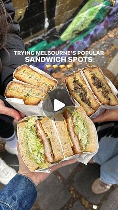 people holding sandwiches in their hands with the words trying melbourne's popular sandwich spots