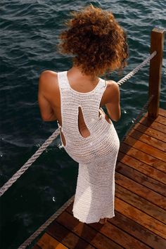 DETAILS: U Neck Featuring Sleeveless Design O-Ring And Cut Out Detail On Side Vacation Style Crochet Maxi Dresses Model is wearing a size S.   Product Measurements  Length  Bust   Label Size  US Size  IN  IN   XS  2  50.00  31.50   S  4  51.18  33.07   M  6  51.18  33.07   L  8 -10  52.36  38.19      Product Measurements  Length  Bust   Label Size  US Size  CM  CM   XS  2  127  80   S  4  130  84   M  6  130  84   L  8 -10  133  97 Chic White Crochet Halter Neck Dress, Sleeveless Hollow-out Crochet Dress For Beachwear, Sleeveless Hollow Out Crochet Dress For Beachwear, White Halter Neck Crochet Dress, Chic White Crochet Dress With Hollow Out Design, Chic White Crochet Dress With Hollow-out Details, White Halter Neck Crochet Summer Dress, White Sleeveless Crochet Dress With Hollow Details, Sleeveless Crochet Dress For Beach Season