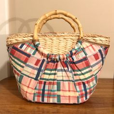 Cute Trendy Straw Woven Beach Bag 100% Straw Bag Covered In Plaid Fabric 2 Bamboo Rings Are The Perfect Size To Wear This Bag In Your Forearm Inside Has A White Linen Lining With 2 Slip Pockets And A Zip Pocket Magnetic Closure This Bag Is In Perfect Condition And Shows No Signs Of Ware Length: Top- 15” - Bottom - 10” Height: 9.5” Width: 6” 17 Woven Beach Bag, Bag Cover, Plaid Fabric, Garden Tote, White Linen, Magnetic Closure, Beach Bag, Mini Bag, Straw Bag