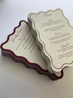 two folded menus on top of each other, one with a red border and the other white