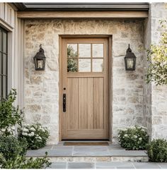 a front door with two lights on each side