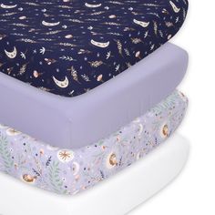 Immerse yourself in the magic of the night sky with our enchanting 4-piece Lunar Love sheet set. The navy blue, lavender and cream colorway is accented by serene moons, whimsical owls, lush foliage, and twinkling stars, creating a tranquil ambiance that's perfect for baby's dream space. Two allover prints and two versatile solids allow for endless style possibilities. Crafted from soft, breathable fabric that's gentle on baby's delicate skin with all-around elastic that ensures a snug fit on mos Purple And Blue Nursery, Dark Purple Nursery, Light Purple Nursery, Girl Crib Sheets, Purple Baby Rooms, Galaxy Nursery, Purple Crib Bedding, Celestial Nursery, Baby Girl Crib Sheets