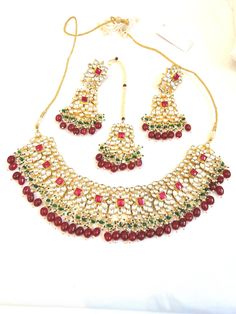 Handcrafted with love to give a real traditional look for this set beautifully studded with pachi kundan stones and pearls give a royal look. Includes: Necklace, Earrings, and Tikka Necklace Set With Earrings, Kundan Necklace Set, Royal Look, Kundan Necklace, Kundan Necklaces, Necklace Earrings, Necklace Set, Jewelry Sets, Crochet Earrings