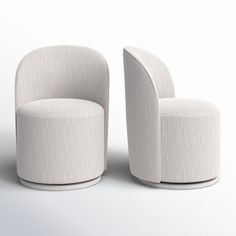 two white chairs sitting next to each other