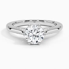 a white gold engagement ring with a round cut diamond