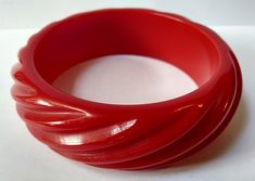 "This vintage cherry red Bakelite bangle measures approximately 2-9/16\" (6.6 cm) across the inside and 13/16\" (2.1 cm) in width. Weighs 53.7 grams. This has been tested positive for Bakelite with Simichrome. Good condition." Red Carved Vintage Jewelry, Carved Red Vintage Jewelry, Vintage Red Round Bangle, Vintage Handmade Red Bangle, Red Retro Bangle Jewelry, Bakelite Bangles, Vintage Cherry, Butterfly Pin, Turquoise Bracelet Cuff