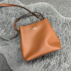 Perfect Addition To All Closets. Can Match With Many Outfits And Home So Much. Two Different Strap Types, Inside Pockets. Smoke Free Home, Never Used. Elegant Cognac Bucket Shoulder Bag, Elegant Cognac Bucket Bag, Elegant Cognac Shoulder Bucket Bag, Elegant Cognac Bucket Bag With Detachable Handle, Elegant Cognac Bucket Bag With Detachable Strap, Everyday Elegant Coach Bucket Bag, Elegant Coach Bucket Bag For Everyday, Elegant Cognac Bucket Bag For Office, Elegant Everyday Coach Bucket Bag