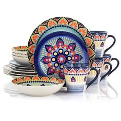 an assortment of colorful dishes and cups on a white surface with the same color scheme