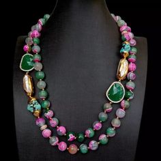 This SHOWSTOPPER pearl necklace is made of fuchsia and green faceted agate, blue turquoise and white biwa pearl, green crystal. This piece blends the best of all worlds in the form of exceptional color, texture, and shine. It is an excellent choice for any special occasion. Diameter: 12mm(agate), 24x28mm(green crystal) Length: 21"-23" / 53.3cm- 58cm weight: 200 gram Clasp: 18 K GP cz Pave clasp with extender Blue Turquoise Necklace, Autumn Necklace, Biwa Pearls, Classic Necklace, Pearl Crystal, Green Agate, Green Crystal, Green Necklace, Green Crystals