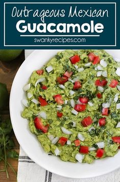 guacamole with tomatoes and onions in a white bowl