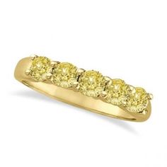 a yellow diamond five stone ring