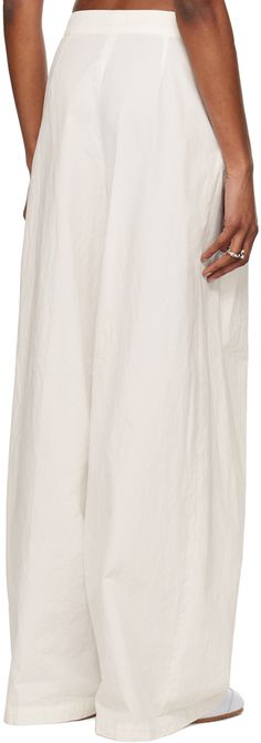 Wide-leg cotton gabardine trousers. · Low-rise · Two-pocket styling · Zip-fly · Pleats at front Supplier color: Off white Spring White Wide Leg Pants With Welt Pockets, White Wide Leg Pants With Straight Hem For Summer, Spring White Wide Leg Pants With Side Pockets, White Wide Leg Pants With Pockets And Straight Hem, White Wide Leg Pants With Pockets For Daywear, White Trousers With Side Pockets, Luxury White Pleated Bottoms, White Non-stretch Pleated Bottoms, Soie Malaquais Dries Van Noten