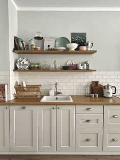 the kitchen counter is clean and ready to be used for breakfast or tea time,