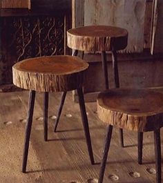 two wooden stools sitting next to each other on top of a hard wood floor