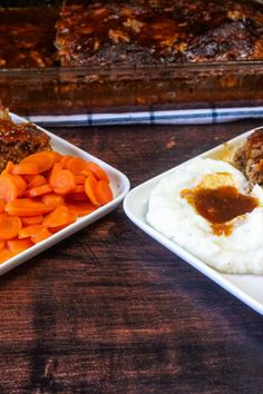 two plates with meat, mashed potatoes and carrots next to a casserole dish