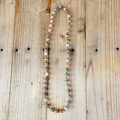 Own this handmade piece of jewelry - a Rainbow Multi-color Stripe (with gold accents) Recycled Paper Beads Necklace - which has been handcrafted by artisan women in Uganda. This strand is pre-strung. Bead Size: 7-12 x 13-25mm Strand Length: 23" Approximate # of Beads: 46 Hole Size: 1mm  MORE ETHNIC UGANDA ITEMS AVAILABLE  Browse our Etsy store for more ethnic jewelry and baskets. We are adding more items every day.  FREE SHIPPING  ---------------------------------------------- ABOUT THE BINJI MINISTRIES  We believe in equipping, teaching and empowering Ugandan widows, abandoned families and communities. This handmade product promotes fair trade. Production provides income opportunities for impoverished communities Uganda. Support of these handicrafts helps women provide an income for their Everyday Artisan Multicolor Jewelry, Multicolor Spiritual Necklace For Everyday Wear, Multicolor Spiritual Necklace For Everyday, Spiritual Multicolor Necklaces For Everyday Wear, Spiritual Multicolor Necklace For Everyday, Earthy Multicolor Beaded Necklaces For Jewelry Making, Multicolor Wooden Beads Necklace For Meditation, Earthy Multicolor Jewelry With Wooden Beads, Everyday Multicolor Wooden Beads Jewelry