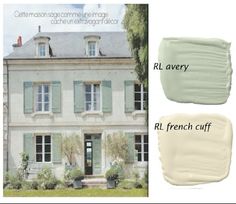 the exterior of a french country house with white paint and green shutters on each side