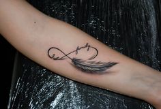 a woman's arm with a tattoo on it that says love and an arrow