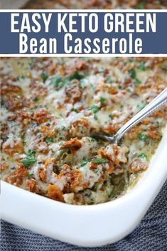 an easy keto green bean casserole recipe in a white dish with a spoon