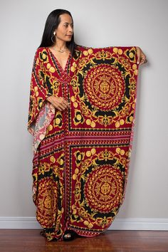 A kaftan maxi dress, which stands out from the crowd because of its contemporary design and gorgeous boho print.  A burgundy red dress with yellow golden boho details like you havent seen before. This long boho dress looks like a classic styled summer dress at first but it features a funky, Bohemian Oversized Tunic Midi Dress, Oversized Bohemian Tunic Midi Dress, Chic Printed Dress With Kimono Sleeves, Chic Printed Dresses With Kimono Sleeves, Bohemian Maxi Dress With Kimono Sleeves For Evening, Oversized Bohemian Printed Dress, Elegant Multicolor Dresses With Kimono Sleeves, Oversized Long Bohemian Dress, Elegant Boho Dress For Party