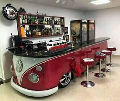 an old vw bus converted into a bar with stools in front of it