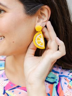 Embrace the zest of summer with our Lemon Earrings. Whether you're strolling through the farmers' market or heading to a sunny brunch, these citrus-inspired earrings will infuse your look with a burst of sunshine and playful charm. Seed bead lemon dangle earrings 2.25" Brass plated Hypoallergenic Surgical steel posts Nickel and lead-free Lemon Earrings, Seed Bead, Farmers Market, Seed Beads, Dangle Earrings, Lemon, Plating, Brass, Beads