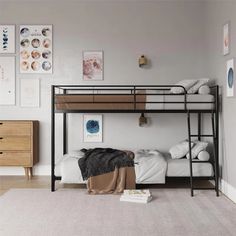 a bunk bed sitting in the middle of a bedroom