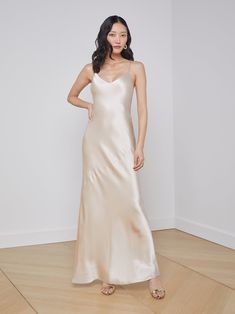 An effortlessly elegant gown length maxi slip dress. A clean v-neckline hangs from adjustable spaghetti straps. Champagne charmeuse silk skims over curves, creating a slinky silhouette. 100% Silk. *This item may run long. Tailoring at the hem may be needed.* Gorgeous Maxi Dresses, Maxi Slip Dress, Silk Slip Dress, Shirt Dress Style, Gowns Of Elegance, Silk Slip, Silk Charmeuse, Satin Dresses, Silk Dress