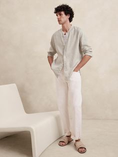 Cut from our signature 100% linen, we love this shirt for its beautiful, natural texture and ability to stay cool and crisp, even in heat and humidity.  Standard fit.  Banded collar and button front.  Shirttail hem.  Standard fit.  Long sleeves.  Hip length.  Model: Size M, 6'2" (188cm). Linen Men Style, Linen Outfit Photoshoot, Mens Beach Photoshoot Outfit, Linen White Shirt Men, Beige Summer Outfit Men, Mexican Guy Outfits, Mens Linen Shirt Outfit, Male Beach Outfit, Linen Men Outfit