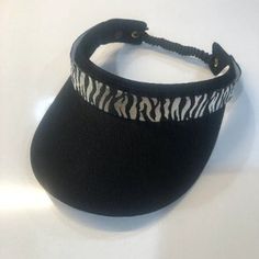 "Visor Versa black lightweight coil-cord visor with 3\" brim.  A Velcro strip on the 1' crown is permanently affixed, as well as the matching black and silver zebra interchangeable band.  Perfect for golf, tennis, pickleball, cruising, beach, or any time you need shade from the sun!  Bands come in over 1000 other options (& visors come in 14 colors and 2 sizes), so the combinations are endless!" Golf Visor, Reading Pa, Black And Silver, Pickleball, Sun Hats, Caps Hats, Leather Bracelet, The Sun, Accessories Hats