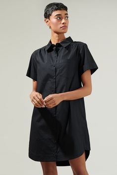 The Kaylee Button Down Shirt will instantly become a wardrobe staple! Fresh cotton fabric shapes this breezy dress that has a collared neckline and dolman short sleeves. The shift silhouette has a functional button placket down the center and ends at a mini hem. It can be easily be paired up with some with sneakers or high knee boots. - Short sleeves- Shirt dress- Button front- Pocket- Comes in 2 colorsSize + Fit - Model is 5'8" and wearing size XS- Measurements taken from size S - Chest: 20 1/2 Cheap Black Short Sleeve Shirt Dress, Button Down Shirt Dress, The Perfect Girl, Breezy Dress, Short Sleeve Dress Shirt, The Shift, Button Front Dress, White Shirt Dress, Black Shirt Dress