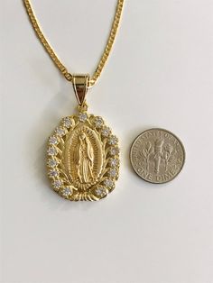 "18K GOLD FILLED GUADALUPE NECKLACE 22\" LONG.. CZ VIRGIN OF GUADALUPE. VIRGIN MARY. FOR GOOD LUCK ,PROSPERITY AND PROTECTION. PENDANT: 40 x 25 mm 18K GOLD FILLED CADENA DE GUADALUPE 22\" LARGO .. VIRGEN DE GUADALUPE CON ZIRCONIA. PARA PROSPERIDAD, BUENA SUERTE Y PROTECCION. DIJE: 40 x 25 mm" Gold Our Lady Of Guadalupe Pendant Necklace, Gold Our Lady Of Guadalupe Round Pendant Necklace, Gold Medallion Necklace With Our Lady Of Guadalupe, Gold Our Lady Of Guadalupe Medallion Necklace, Gold Medallion Necklace Of Our Lady Of Guadalupe, Gold Our Lady Of Guadalupe Medallion, Takuache Girl Outfits, Guadalupe Necklace, Protection Pendant