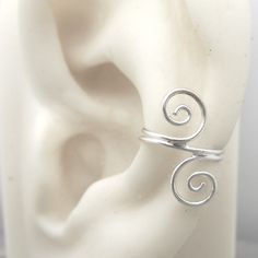 Includes One 925 Sterling Silver Swirl Ear Cuff. Crafted With Love, These Ear Cuffs Feature A Stunning Leaf, Perfect For Adding A Touch Of Romance To Any Outfit. With The 925 Signed Hallmark, You Can Trust The Quality And Authenticity. Made With 925 Sterling Silver, These Earrings Are Not Just Beautiful But Also Durable. Elevate Your Look With Our Ear Cuffs And Make A Statement Wherever You Go. Bundle To Save. Adjustable Hypoallergenic Sterling Silver Ear Cuff, Adjustable Silver Ear Cuff With Ear Wire, Adjustable Sterling Silver Ear Cuff With Ear Wire, Adjustable Hypoallergenic Sterling Silver Wrap Earrings, Adjustable Sterling Silver Ear Cuff, Hypoallergenic Sterling Silver Ear Cuff, Sterling Silver Adjustable Pierced Ear Climbers, Adjustable Sterling Silver Pierced Ear Cuff, Elegant Silver Spiral Ear Cuff