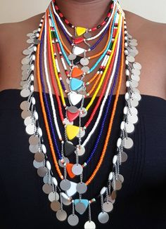 This necklace is 100% handcrafted using colorful fine beads. Perfect for weddings, traditional events, parties or any other occasion. The necklace has 13 strands all joined together. Buy multiple items and pay shipping for ONE item only. **This necklace ships via DHL Express.(They take 3 to 5 days). More neckleces here; https://www.etsy.com/shop/TribalTess?ref=seller-platform-mcnav&section_id=21306083 Back to my shop; https://www.etsy.com/shop/TribalTess?ref=seller-platform-mcnav Handmade Multi-strand Necklaces For Festivals, Multi-strand Colorful Beads Necklace For Festivals, Unique Multi-strand Festival Necklace, Bohemian Multi-strand Necklace For Festivals, Bohemian Multi-strand Layered Necklace For Festivals, African Wedding Jewelry, Valentine Necklace, Necklace African, African Necklace