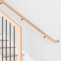 an image of a stair case with railings on the bottom and hand rails down