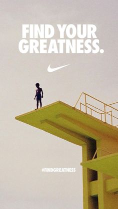 a man standing on top of a tall yellow building with the words find your greatness