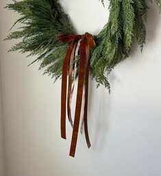 a green wreath hanging on the wall