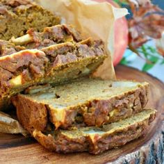 sliced loaf of bread sitting on top of a wooden cutting board