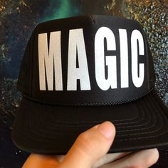 Magic In White Glitter Vinyl On Black Trucker Hat New Made By Me Black Curved Brim Mini Hat For Festivals, Black Mini Hat With Curved Brim For Festivals, Black Snapback Mini Hats For Party, Black Hip Hop Hat For Spring, Black Trucker Hat For Party With Curved Brim, Casual Black Costume Hat With Curved Brim, Casual Black Costume Hat One Size, Hip Hop Black Hats For Spring, Black Snapback Hat For Summer Festival