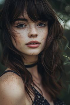 Portrait of a woman with freckles, tousled hair, and a dark choker necklace looking at the camera. Cornrow Ponytail Hairstyles, Easy Back To School Hairstyles, Braiding Ideas, Heart Shaped Faces, Cornrow Ponytail, Shoulder Length Curly Hair, Textured Haircut, Braid Inspiration