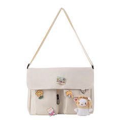 PRICES MAY VARY. ✅【HIGH QUALITY CANVAS】 The kawaii canvas shoulder bag is made of high-quality encrypted canvas, which is wear-resistant and good in texture, durable to use. ✅【LARGE CAPACITY】 Size: 11.81*9.05*3.54in. The storage space of this canvas messenger bag is big enough for your daily belongings. You can easily take your iPad, cell phone, book, wallet, makeup, etc. with you. ✅【KAWAII ACCESSORIES】Comes with 4 kawaii pins and 1 bear pendant. You can also DIY the cute crossbody bag with othe Cheap Student Satchel With Pockets, Everyday Kawaii Satchel Shoulder Bag, Kawaii Everyday Satchel Shoulder Bag, Messenger Bag With Pins, Kawaii Shoulder Bag With Adjustable Strap, White Messenger Bag, Kawaii Crossbody Shoulder Bag, Cute Messenger Bags, Cheap Kawaii Shoulder Bag With Cat Design