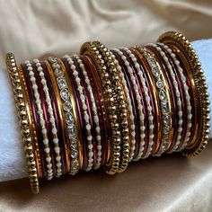 This includes 2 mini stacks of metal antique gold, maroon and orange bangles. Champagne zircon crystal details.  Both arms, 2.4 only ✨ Ready to ship 📦(Does not include same roll seen in photo) Adjustable Jeweled Bangle As Gift, Adjustable White Jeweled Jewelry, Adjustable Metal Bangle For Celebration, Adjustable Metal Jewelry For Festive Occasions, Festive Adjustable Jeweled Bangle, Adjustable Jeweled Bangle For Festive Occasions, White Jeweled Bangle, Orange Bangles, Wedding Jewelry Earrings