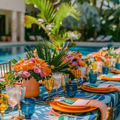 an outdoor table set with orange and blue place settings