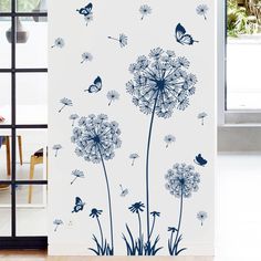 the dandelion wall decals are designed to look like they have butterflies on them