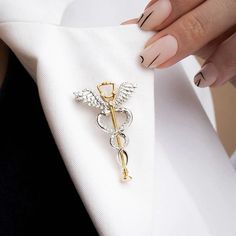 Find a lot more medical pins and nurse brooches in our Shop! https://www.etsy.com/shop/OrbitalEdge These pins are excellent thank you gift for doctors, medical students, nurses, and healthcare professionals. This caduceus brooch featuring a stethoscope is a stylish complement to everyday wear. The pin is available in 2 variants; gold and silver tones. This medical pin is made of plated stainless steel (not an enamel pin) an perfect gift for healthcare workers.  FREE SHIPPING: We offer free shipping on orders of 3 PINS OR MORE. All orders shipped from the USA. GIFT BOX: We also offer a 3D plastic gift/display box for an extra $2 that you can add to your orders. Contact us if you need custom packaging, additional instructions, or messages for bulk orders (3 or more units). MATERIAL: These me Resident Doctor, Doctor Jewelry, Medical Pins, Medical Quotes, Nurse Jewelry, Medical Student Motivation, Nursing Pins, Medical Jewelry, Medical School Inspiration