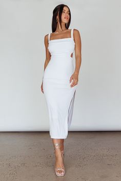 White midi dress Lined Elasticated shoulder straps Side split Strappy, tie-up back Stretchy fabric Steal the limelight in our hot Cosmic Love midi dress. We are in love with its strappy back and sexy, thigh-high split. Perfect for a special birthday celebration. Team it with white, strappy heels and a saddle bag for a look that will turn heads. MODEL INFO Model is wearing size S Height: 5'2" Bust: 33.5" Waist: 25" Hips: 35" CARE Hand Wash Cold. Do Not Iron. MATERIAL RAYON/SPANDEX Chic Midi Dress With Tie And Strappy Back, Fitted Strappy Back Dress For Day Out, Fitted Dress With Strappy Back For Day Out, Tie-back Midi Dress For Night Out, Chic Fitted Midi Dress With Strappy Back, Chic Strappy Back Midi Dress For Day Out, Flirty Backless Summer Midi Dress, Chic Midi Length Dresses With Straps, White Strappy Dress For Brunch